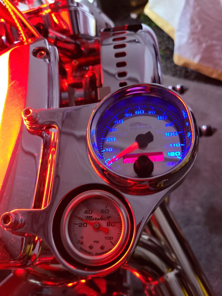 Custom chopper instrument cluster with illuminated speedometer and oil pressure gauge